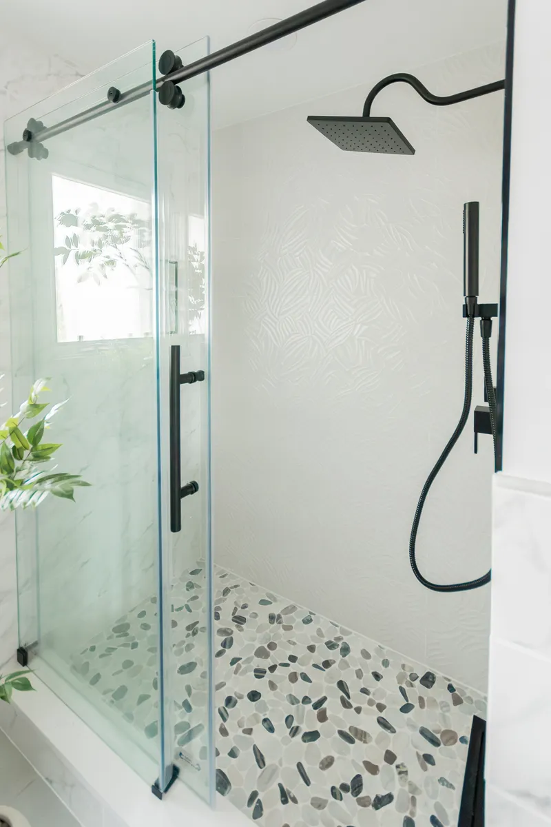 Bathroom renovation - glass shower with pebble floor